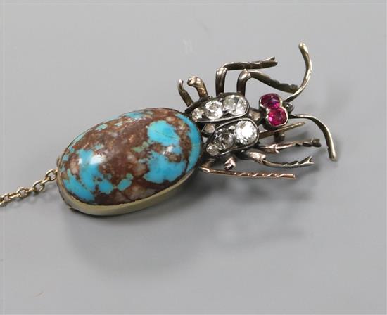 A Victorian yellow metal, turquoise, diamond and ruby set bug brooch, 36mm.